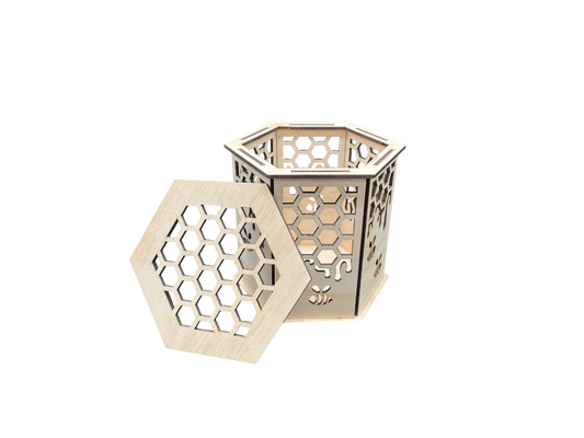 Laser-cut hexagon wooden gift box with honeycomb and bee pattern, lid removed, showing interior.