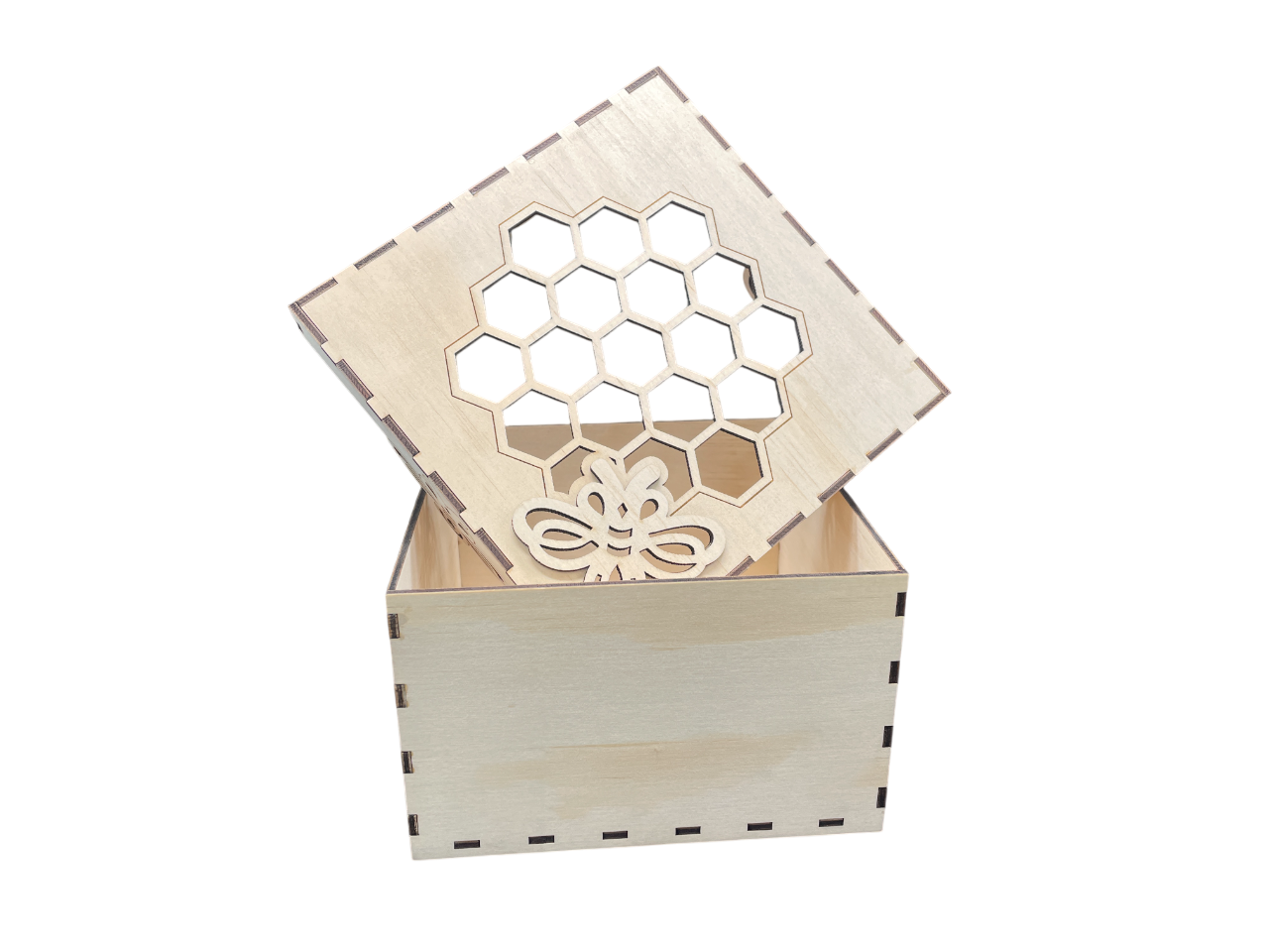 Laser-cut wooden gift box with honeycomb pattern and bee design, lid partially open – ideal for keepsakes or small gifts.